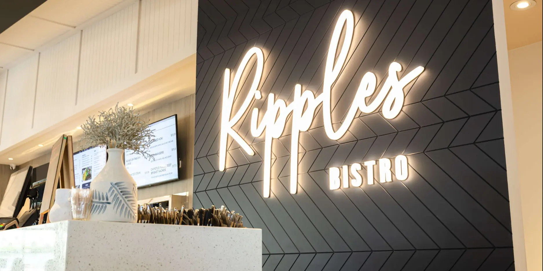 Illuminated Sign in Auckland CBD with custom lighting in gold
